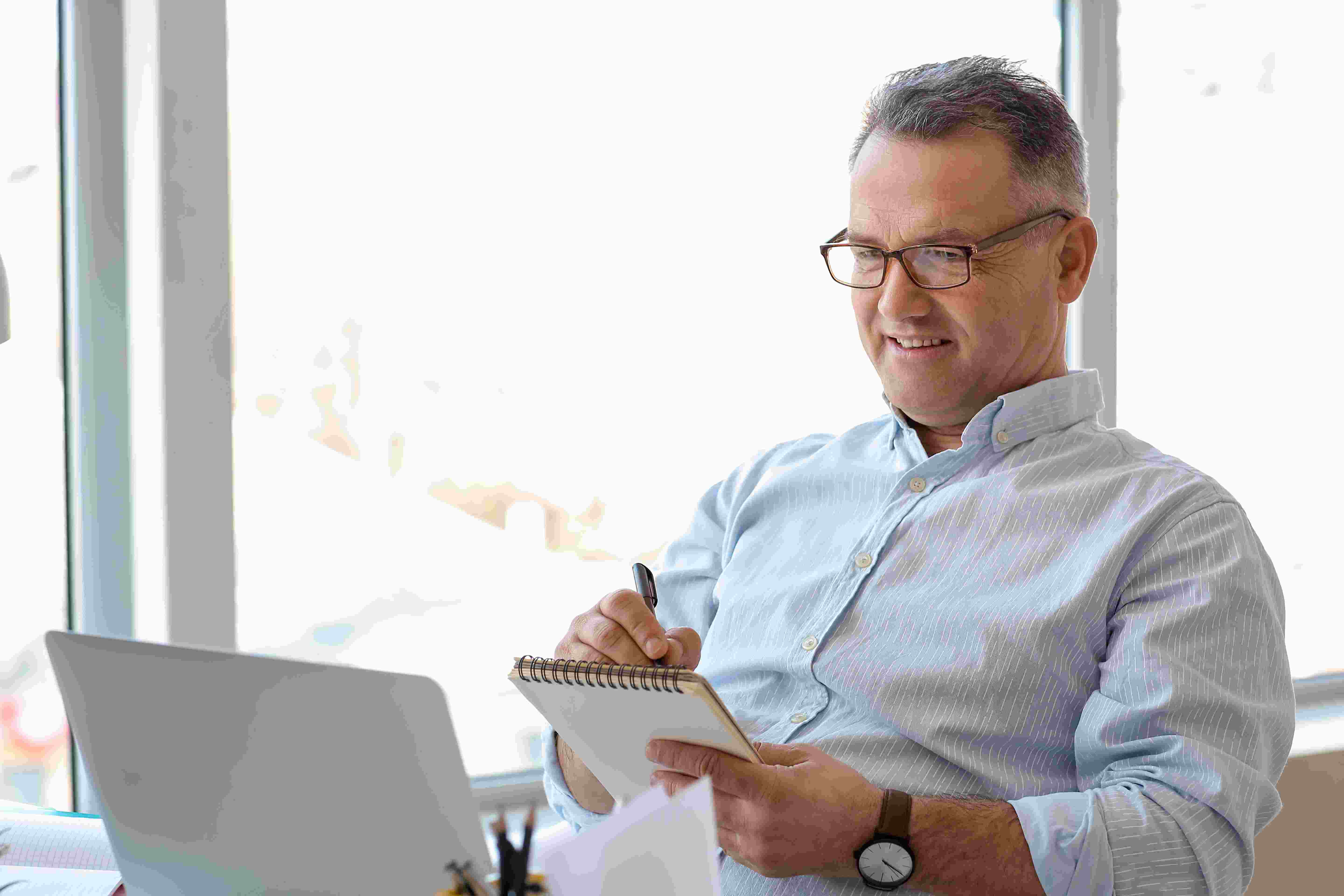 mature-man-using-laptop-at-home